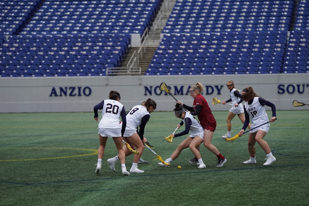 people playing hockey during daytime