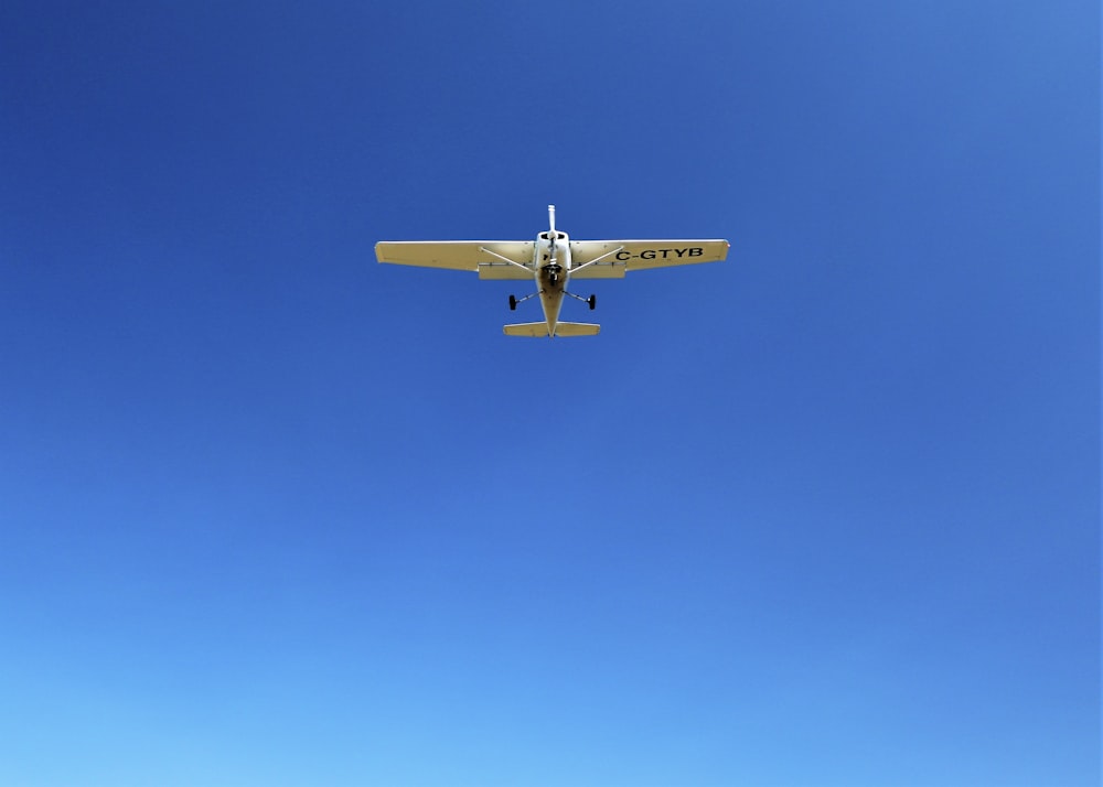 white monoplane on flight