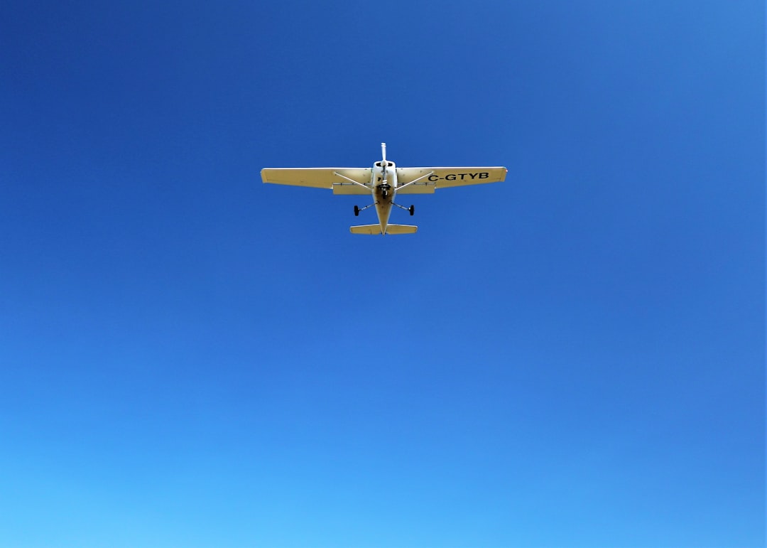 white monoplane on flight