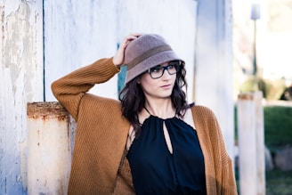 woman leaning on wall