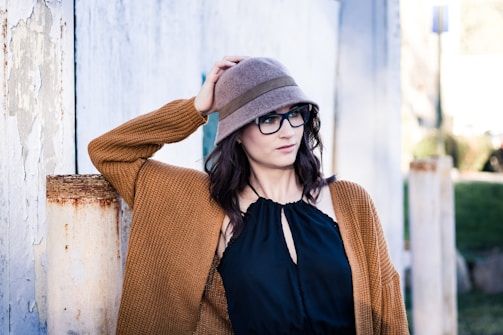 woman leaning on wall