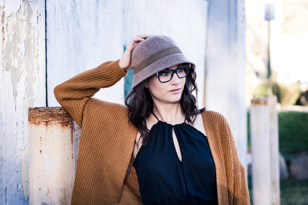 woman leaning on wall