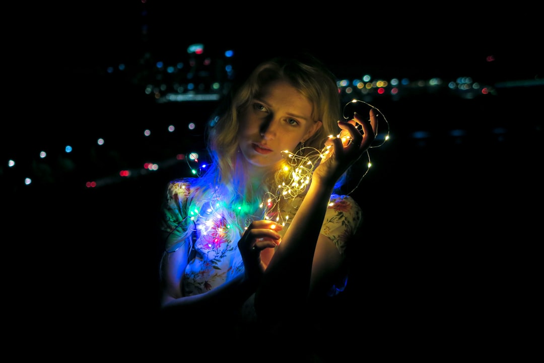 woman holding string light