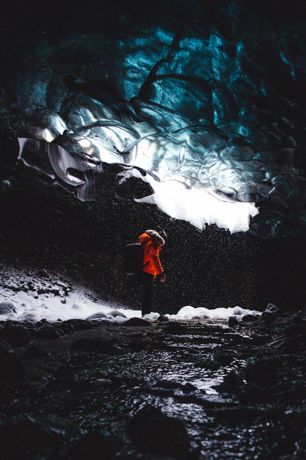 person standing inside the cave