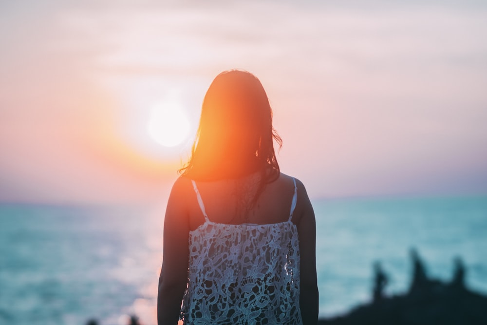 woman overlooking shore