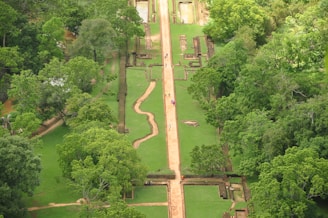 A serene view of Lodha Sylvan’s lush green podium garden with walking paths and seating areas.
