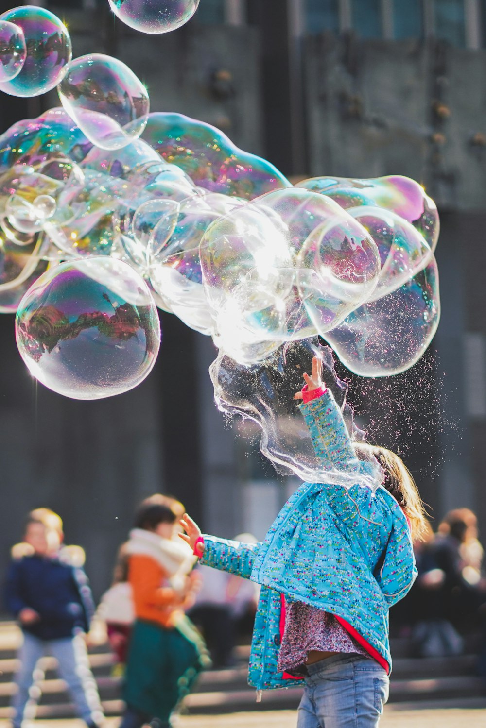 woman blowing bubbles