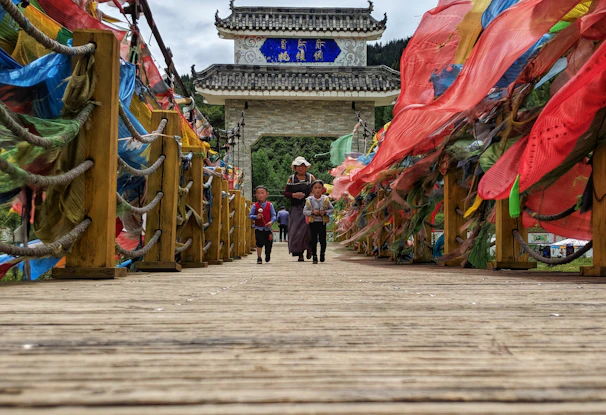Children crossing a newly built modular bridge, smiling and happy.