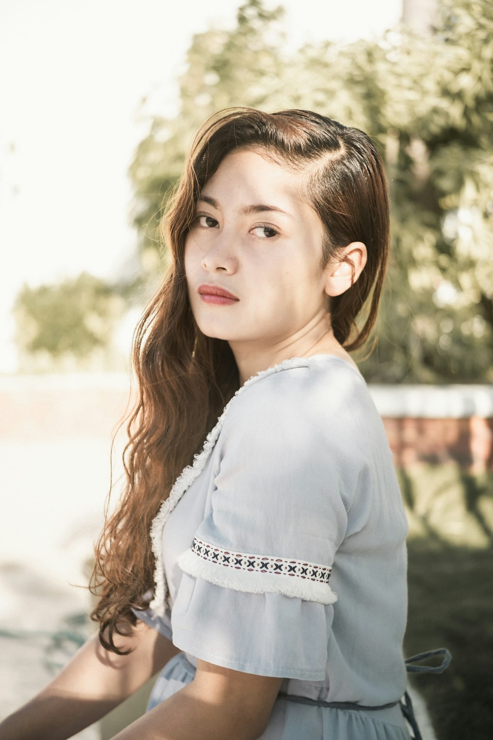 woman in blue short-sleeved dress