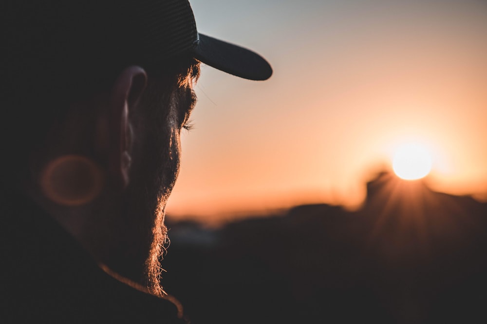 man facing sun during golden hour