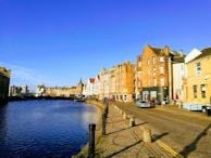 A scenic view of a historic village with cobblestone streets.