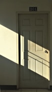white wooden 6-panel door