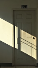 white wooden 6-panel door