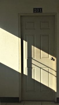 white wooden 6-panel door