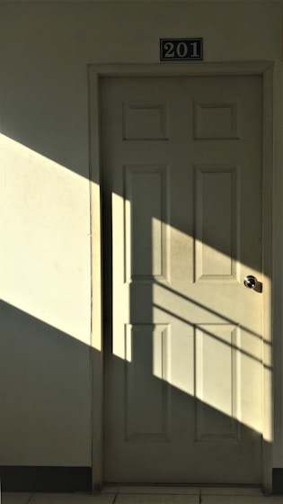 white wooden 6-panel door