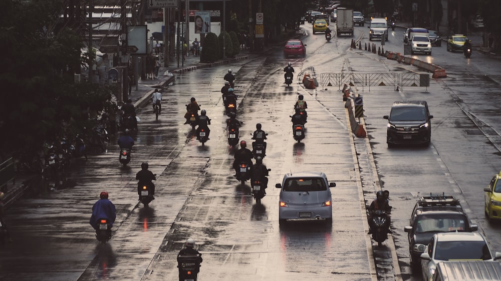 aerial view photography of vehicles passing on road during daytime