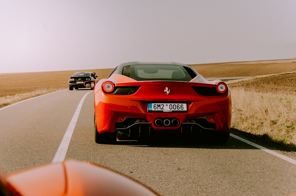 red Ferrari coupe on road