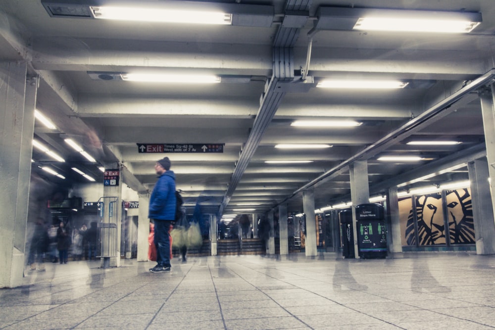 man in blue jacket in selective colors photography