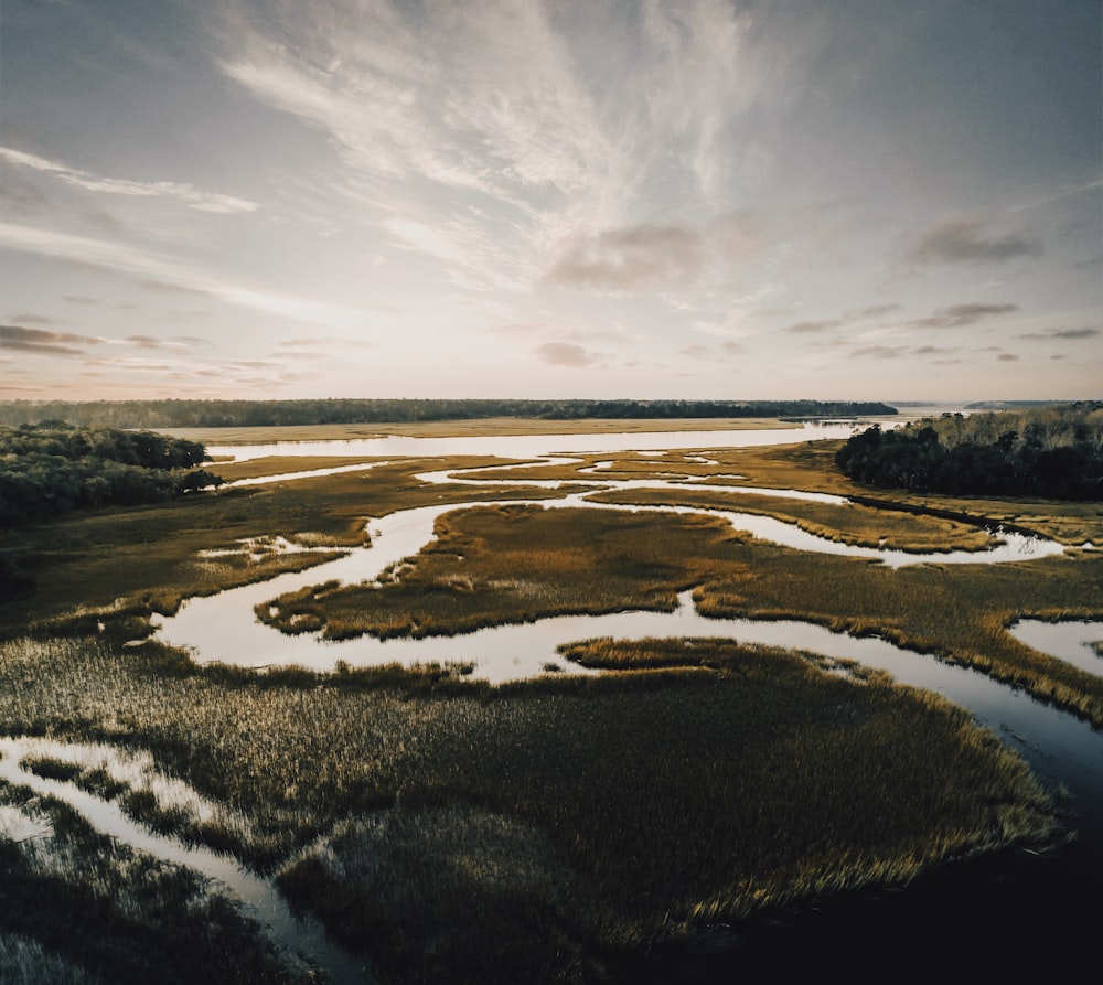 winding river across plains under downcast ssky