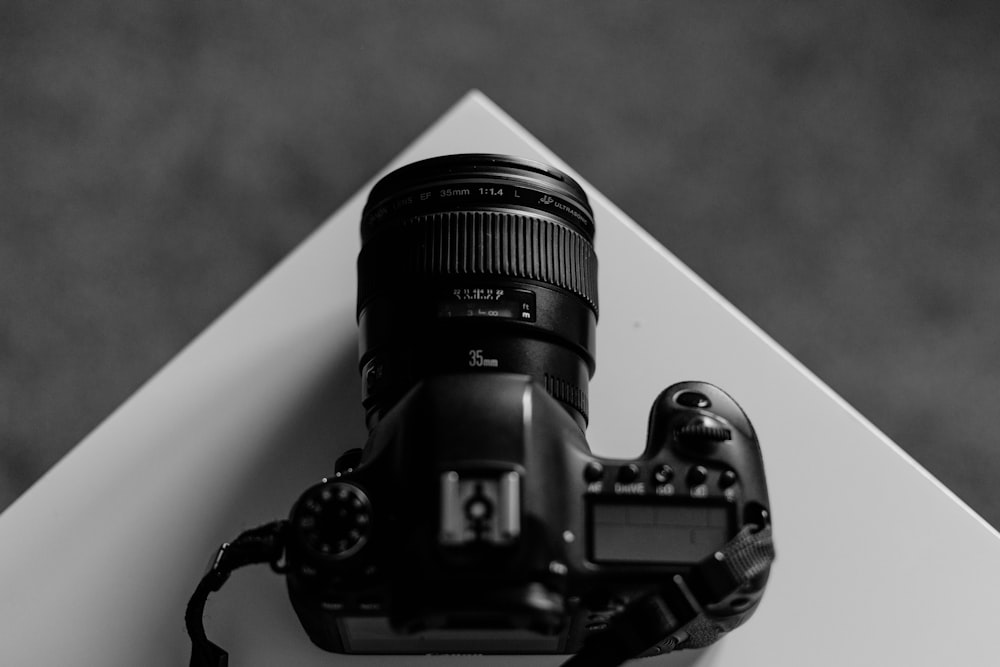 grayscale photography of DSLR camera