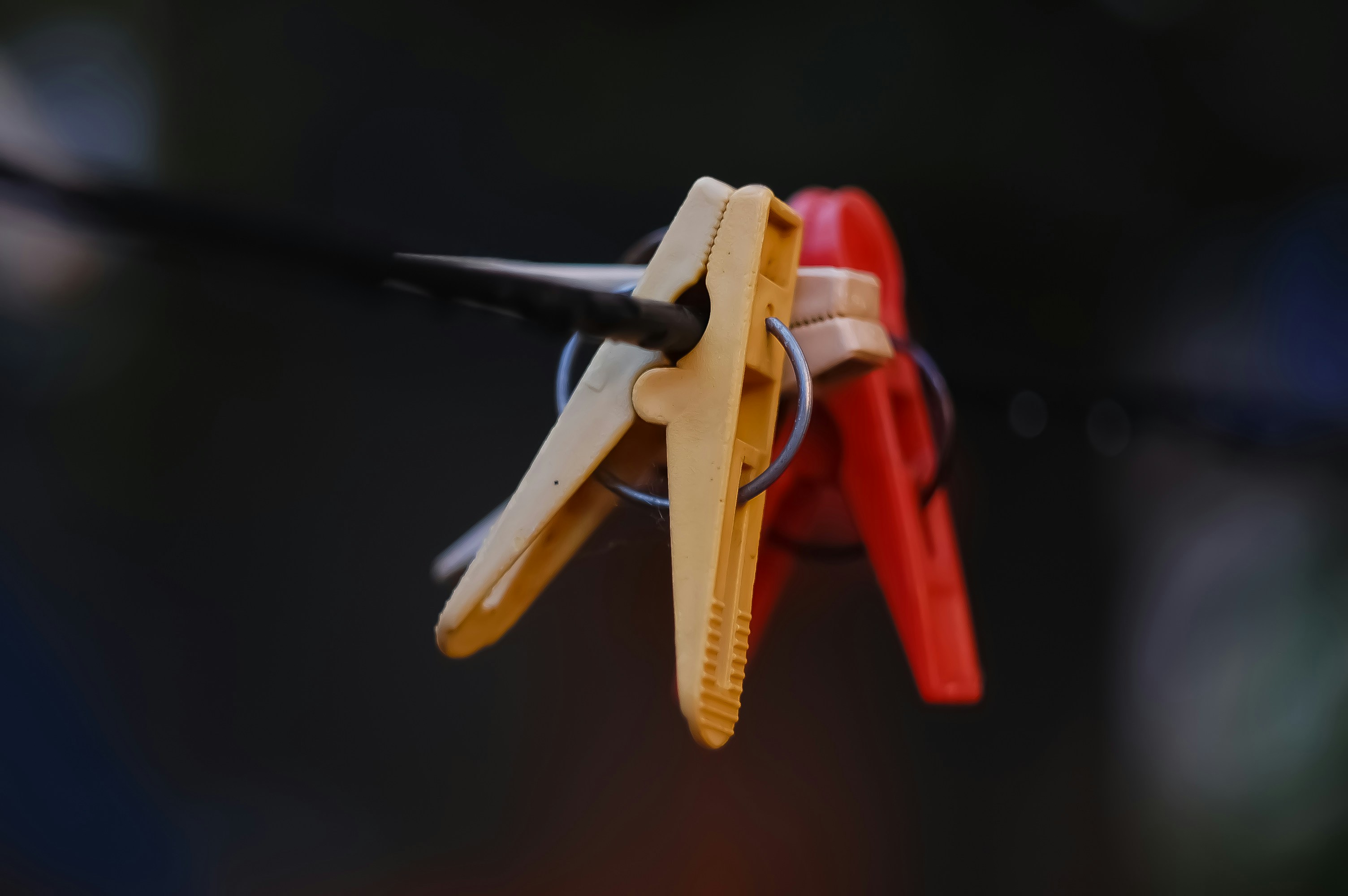 three cloths pin clipped on wire