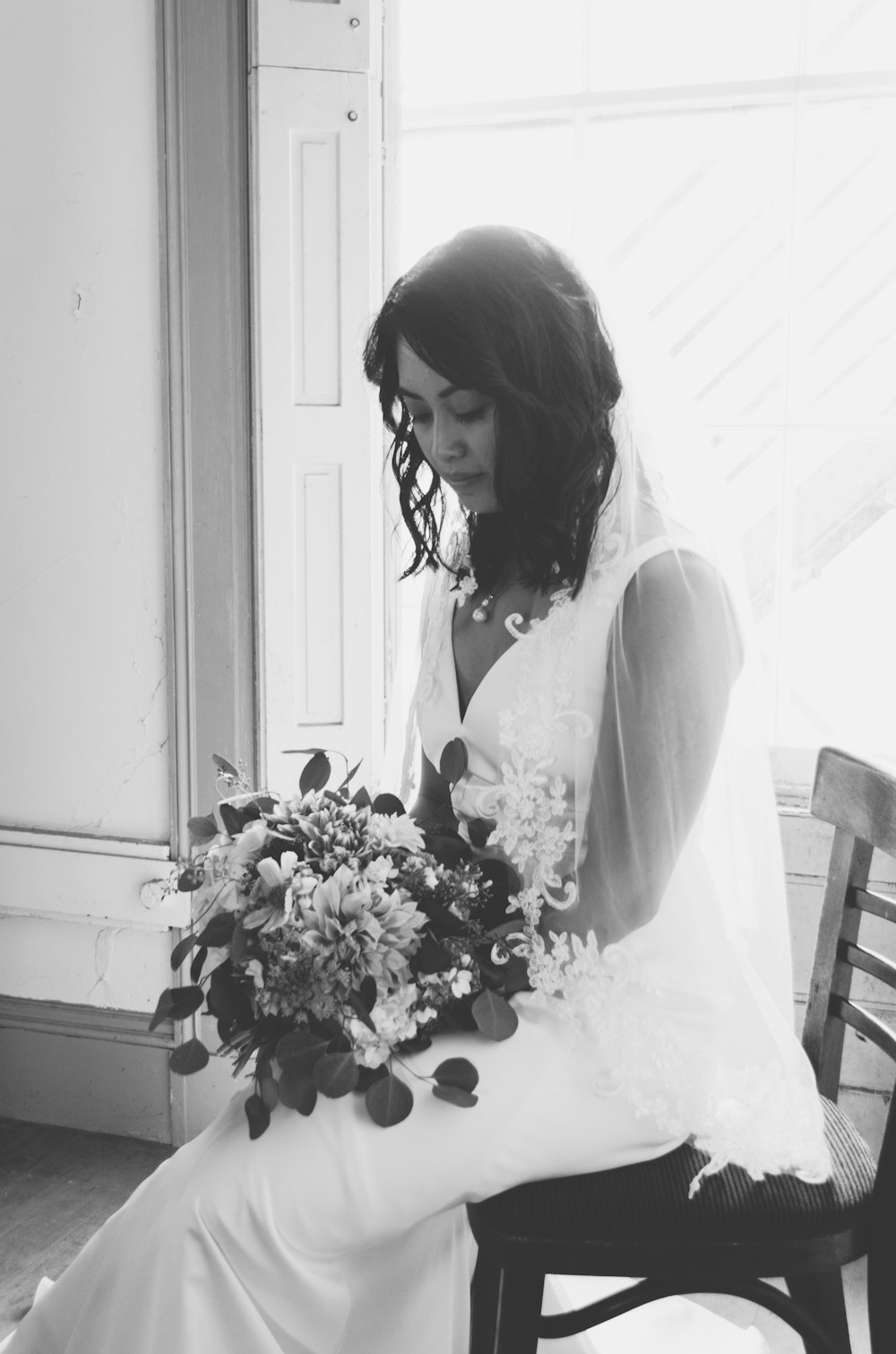 grayscale photography of woman wearing wedding dress