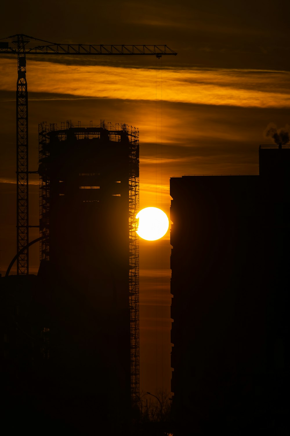 silhouette of crane tower