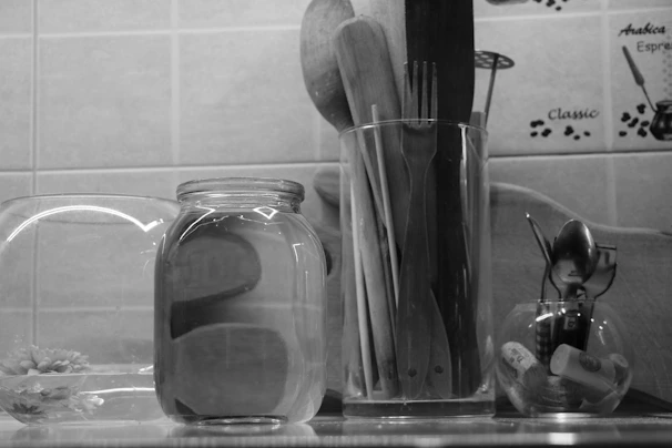 A cozy kitchen countertop displaying an assortment of colorful utensils and tools from Vics Kitchen.