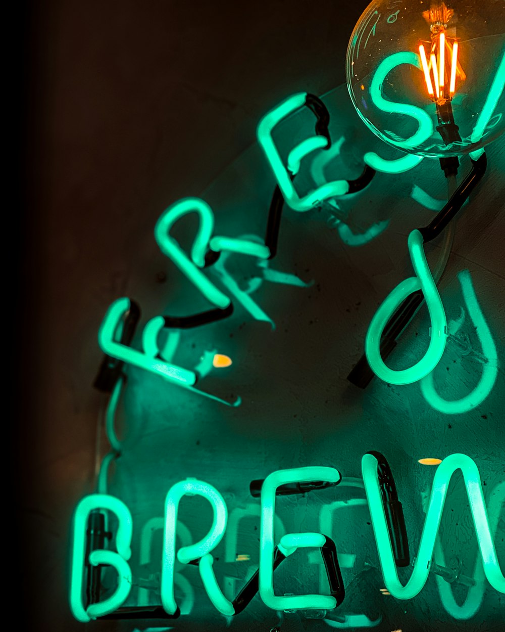 green neon light signage turned-on