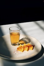 round white ceramic plate with sliced oranges