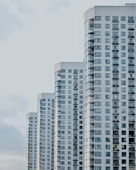 four white painted buildings