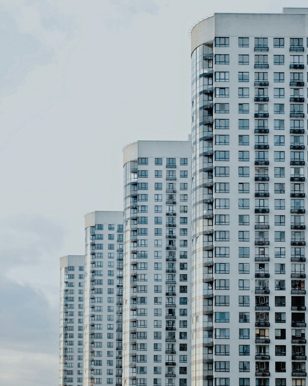 four white painted buildings