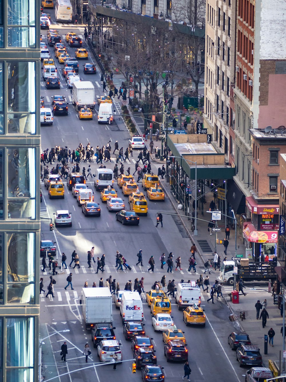 people and cars on road