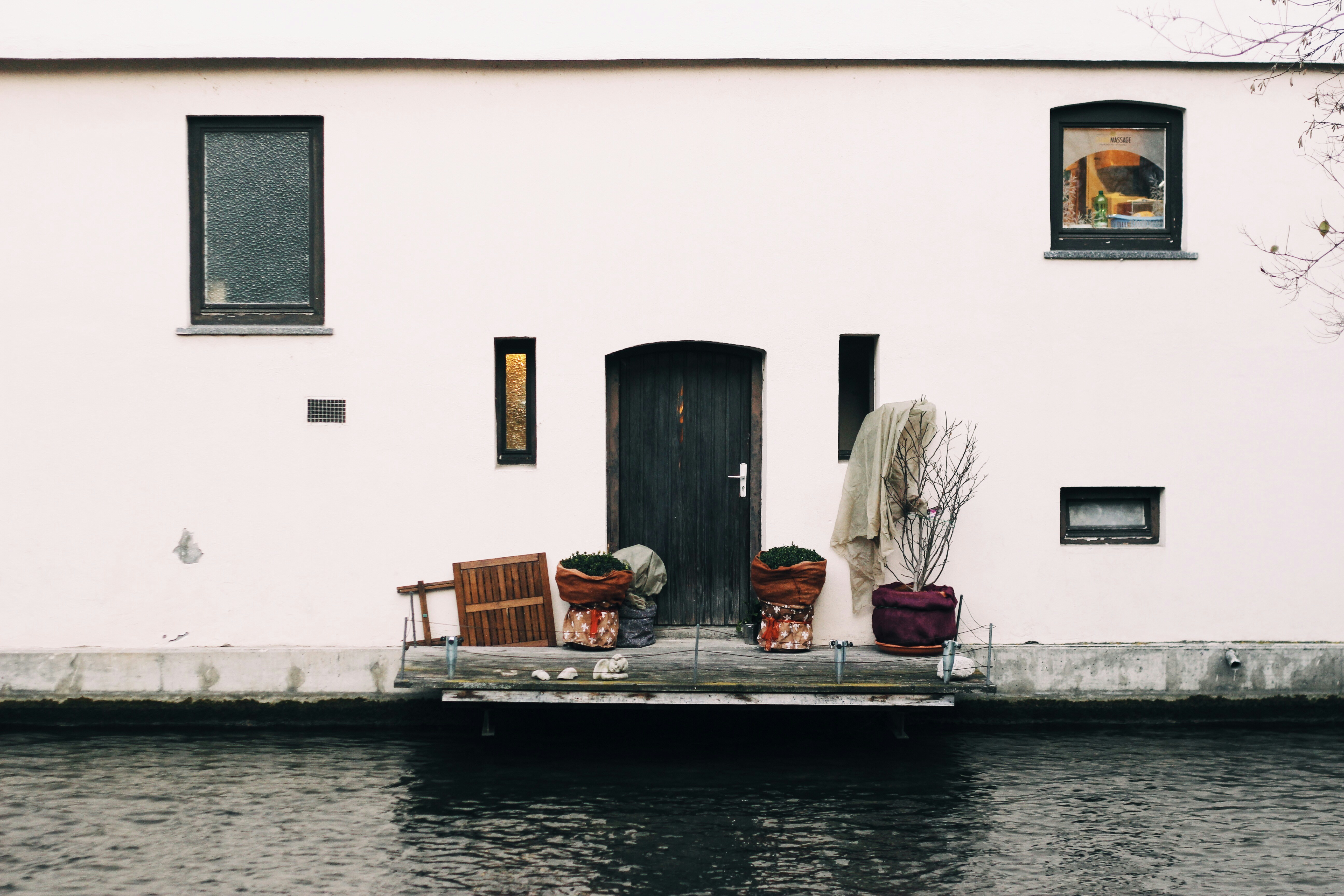 closed door near calm body of water