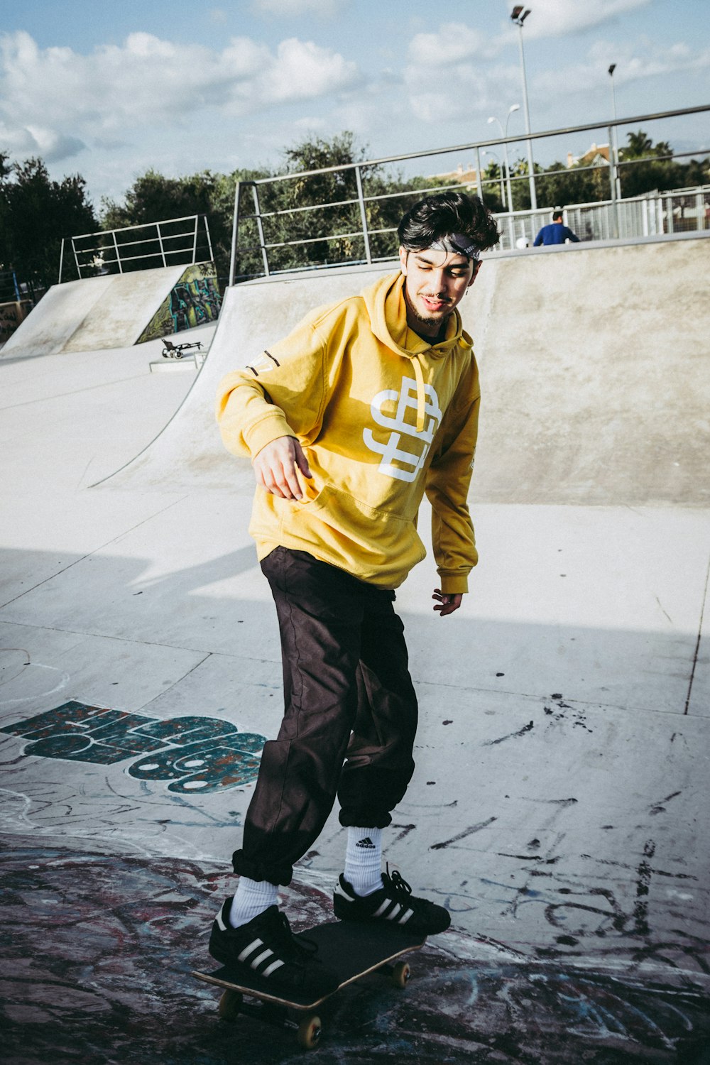 man standing on skateboard during daytime