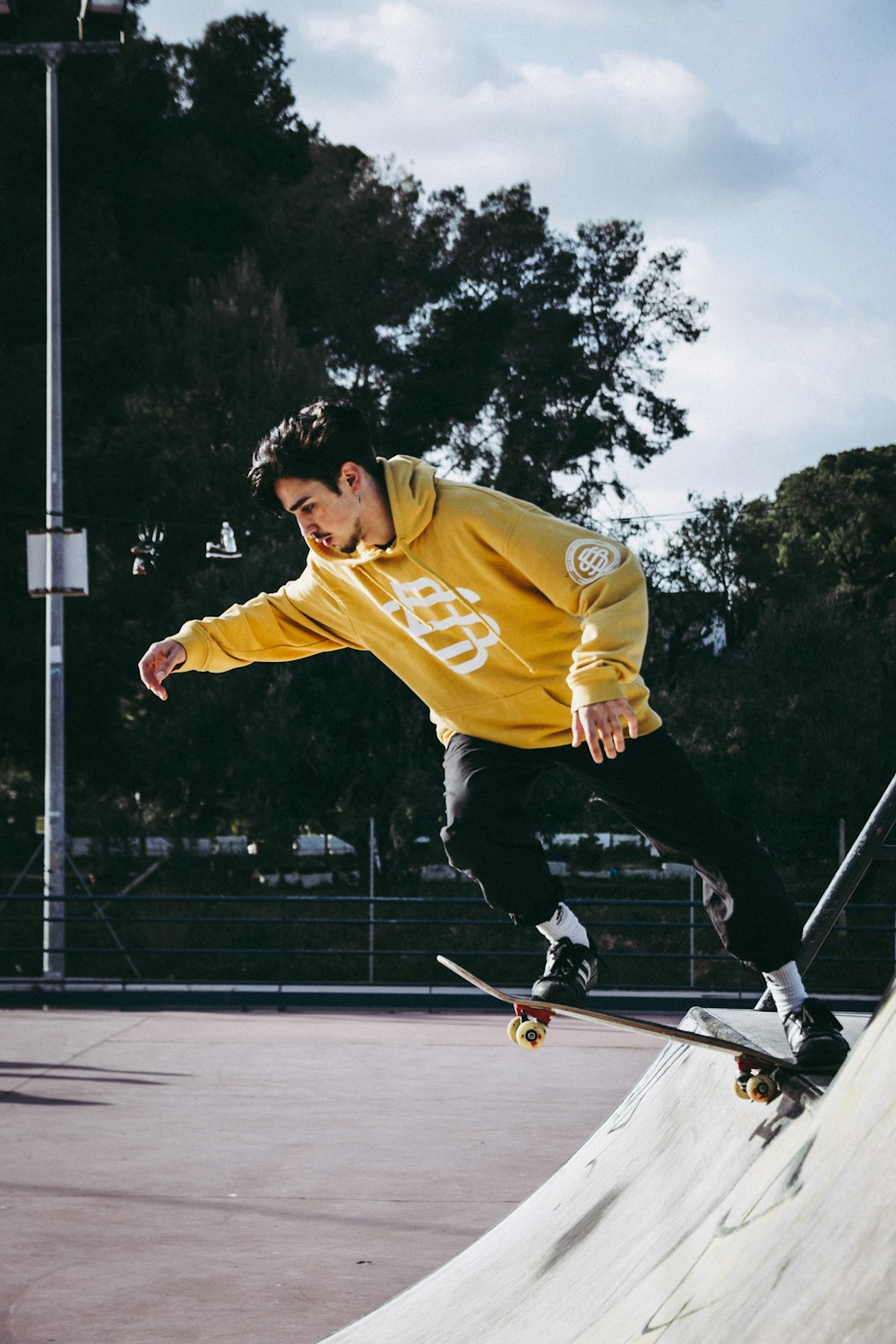 man riding black skateboard doing tricks