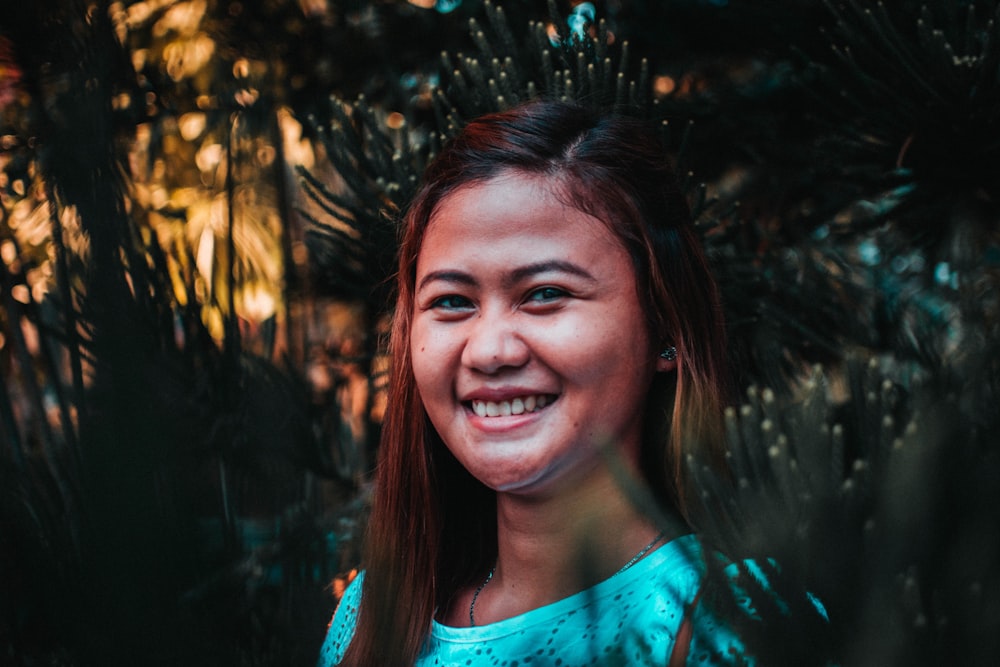 selective focus photography of woman under tree