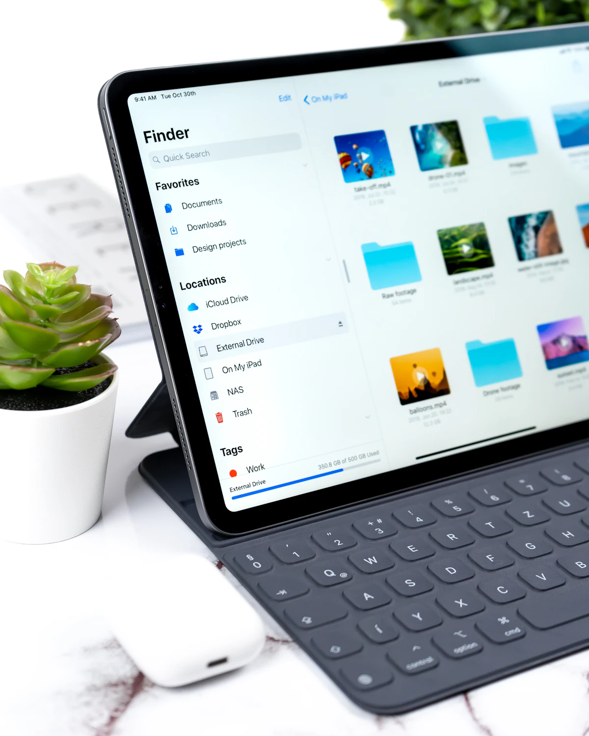 Stock photo of iPad and app files for iOS app development workflow