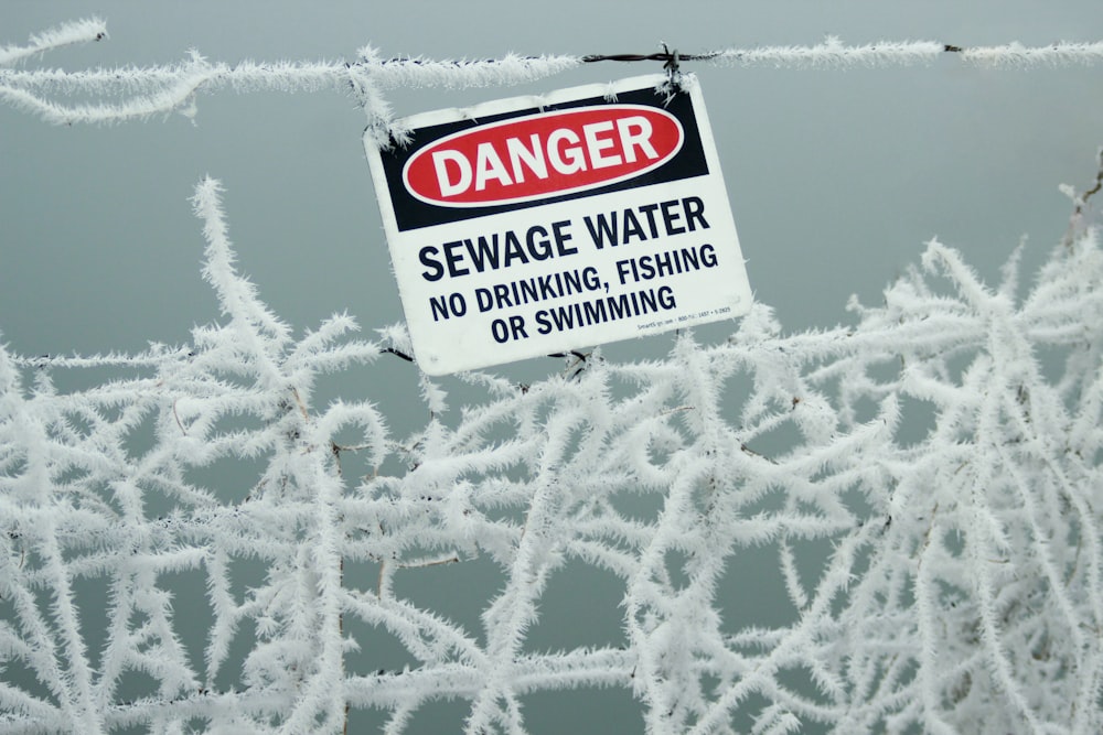 Danger sewage water signage