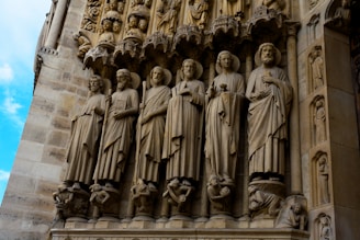 high-relief sculptures of men