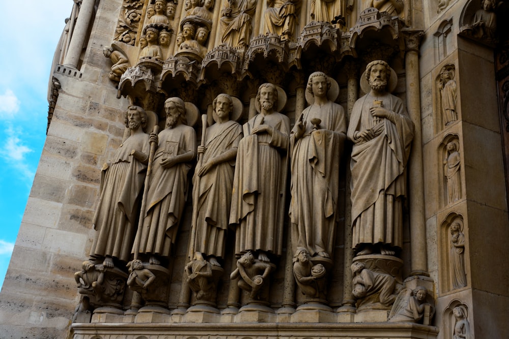 high-relief sculptures of men