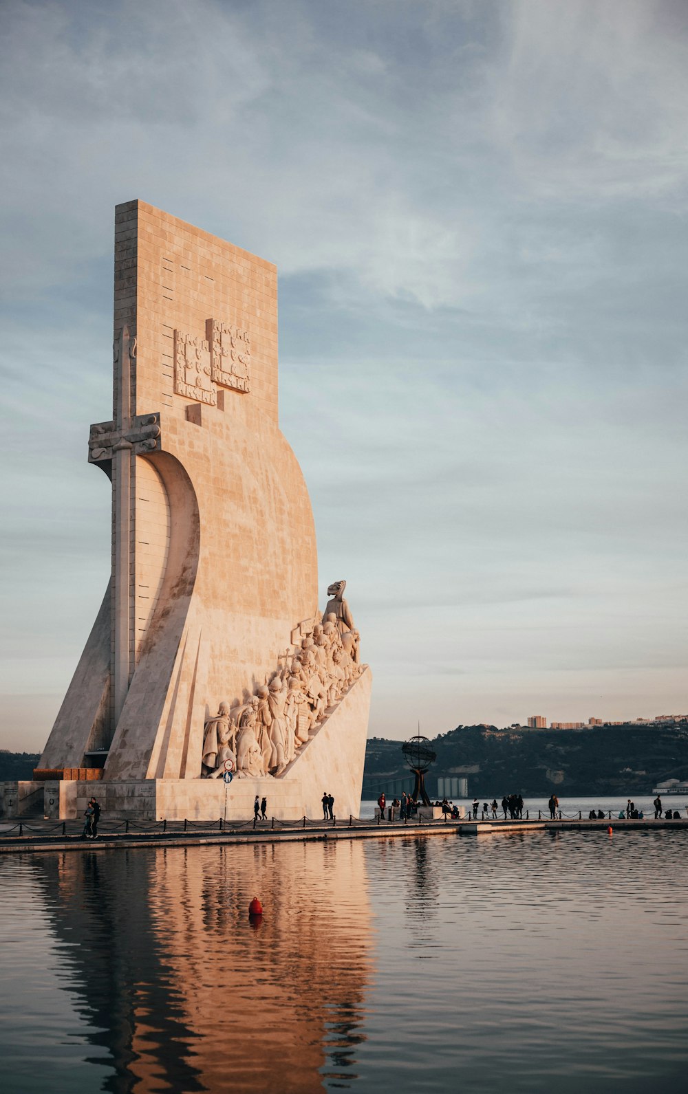 beige concrete building near water