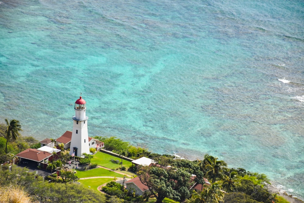 white lighthouse near body of water