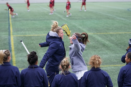A joyful moment of a doubles team celebrating a winning point during a local East Anglia padel match.