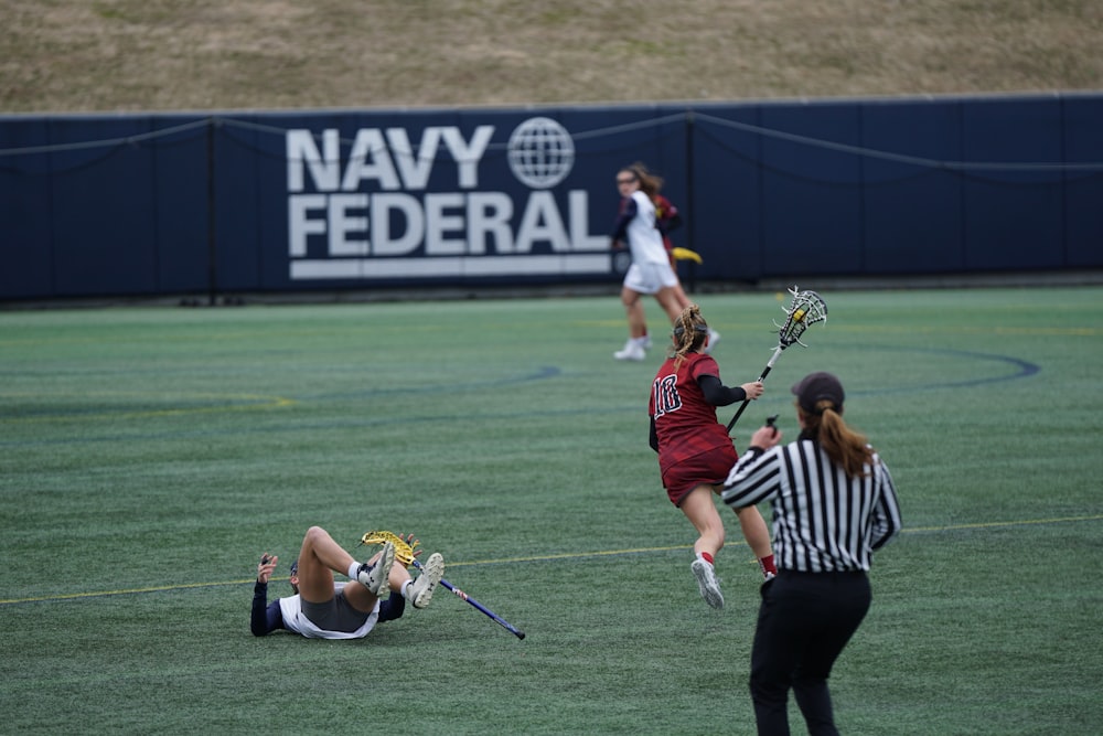 women playing lacrosse sports