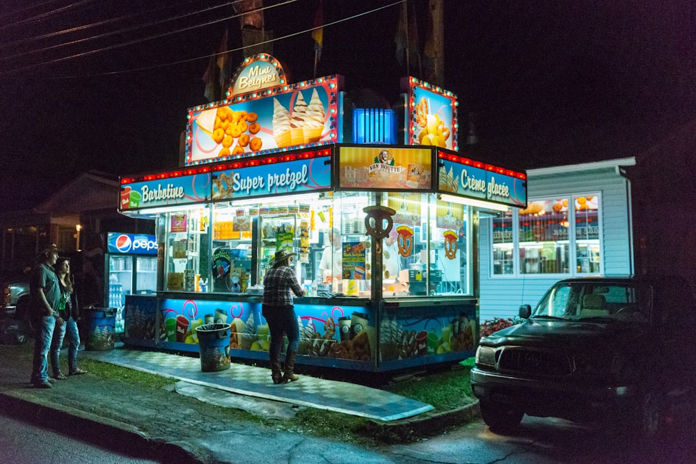 people in front of store during night