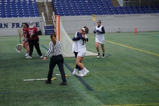 Players in north carolina blue jerseys celebrating a game-winning basket on the court.