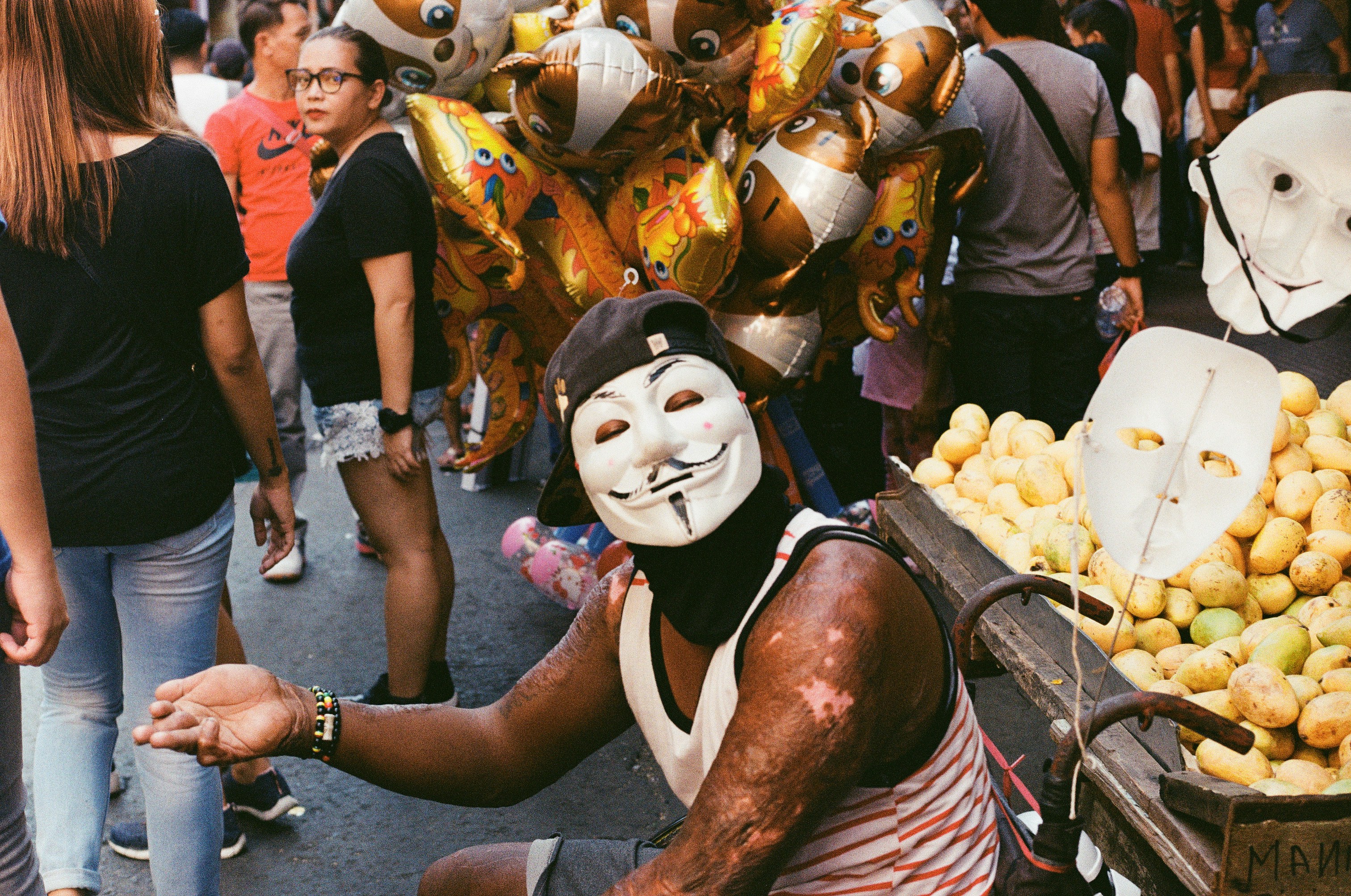man wearing guy fawkes mask