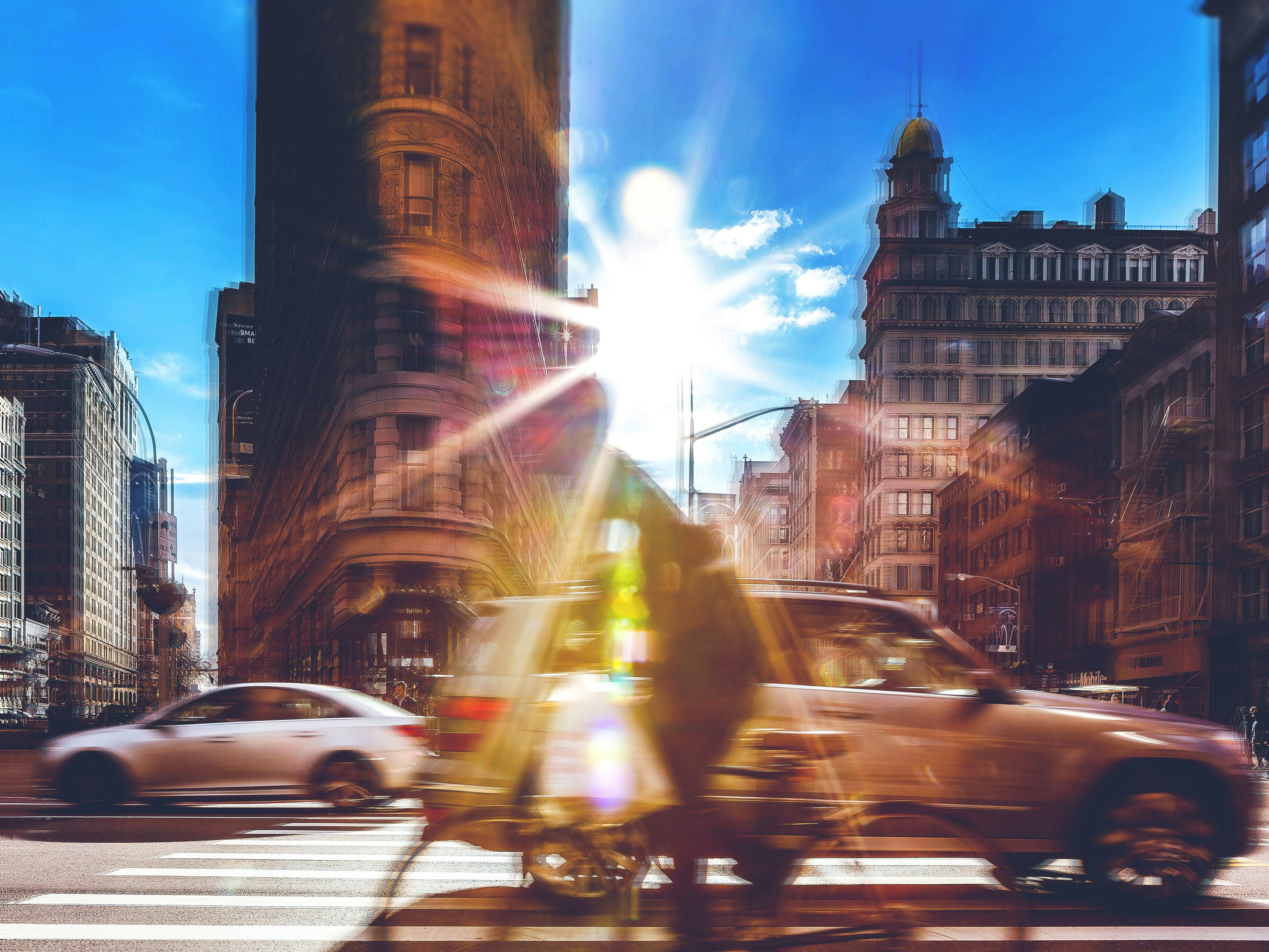 man standing beside SUV near on flatiron building