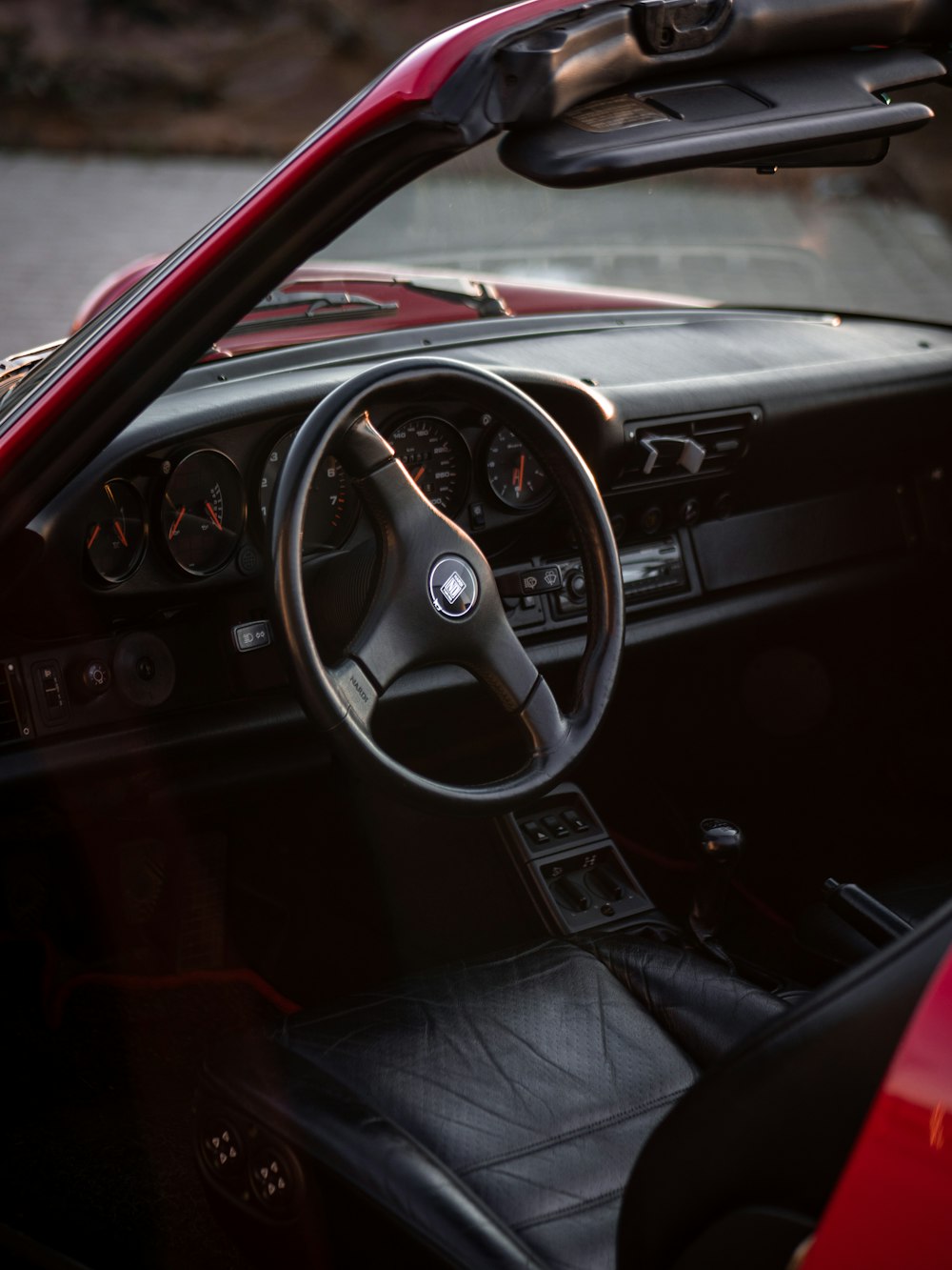 red vehicle with black steering wheel